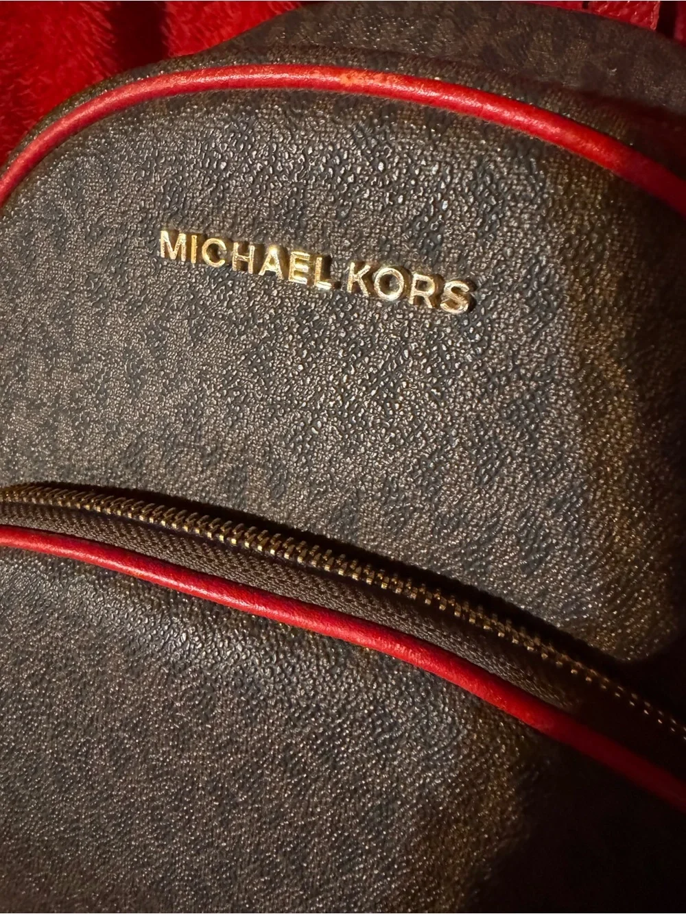 Michael Kors Brown Monogram Backpack with Red Trim and Gold Logo